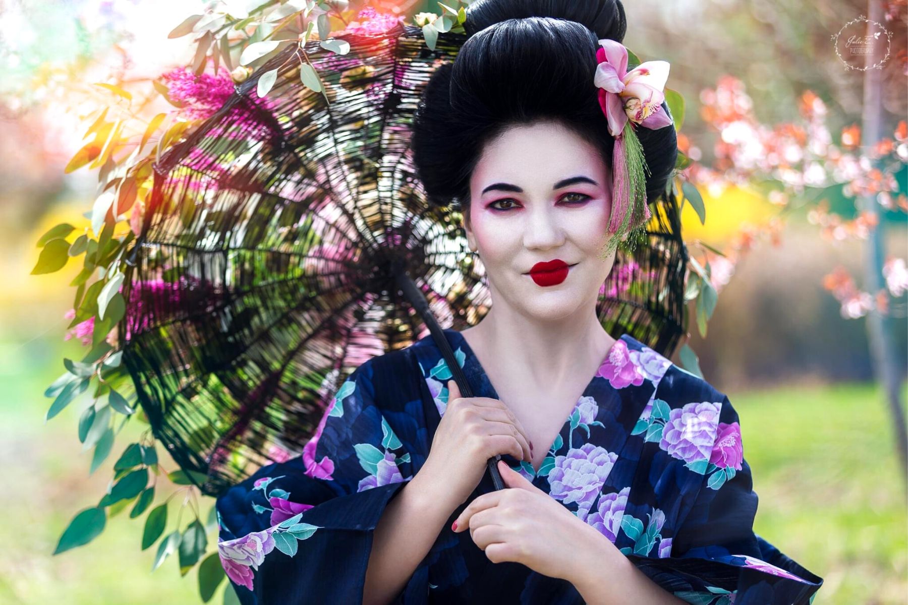 Geisha Adorned With a Flowered Umbrella and Floral Hair Jewelry - Blog o