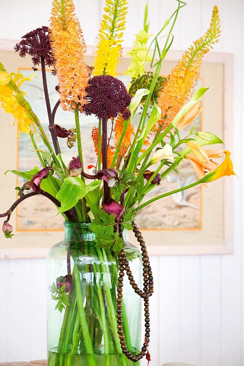 Layered spaces featuring mix of flowers and orange callas on thursd