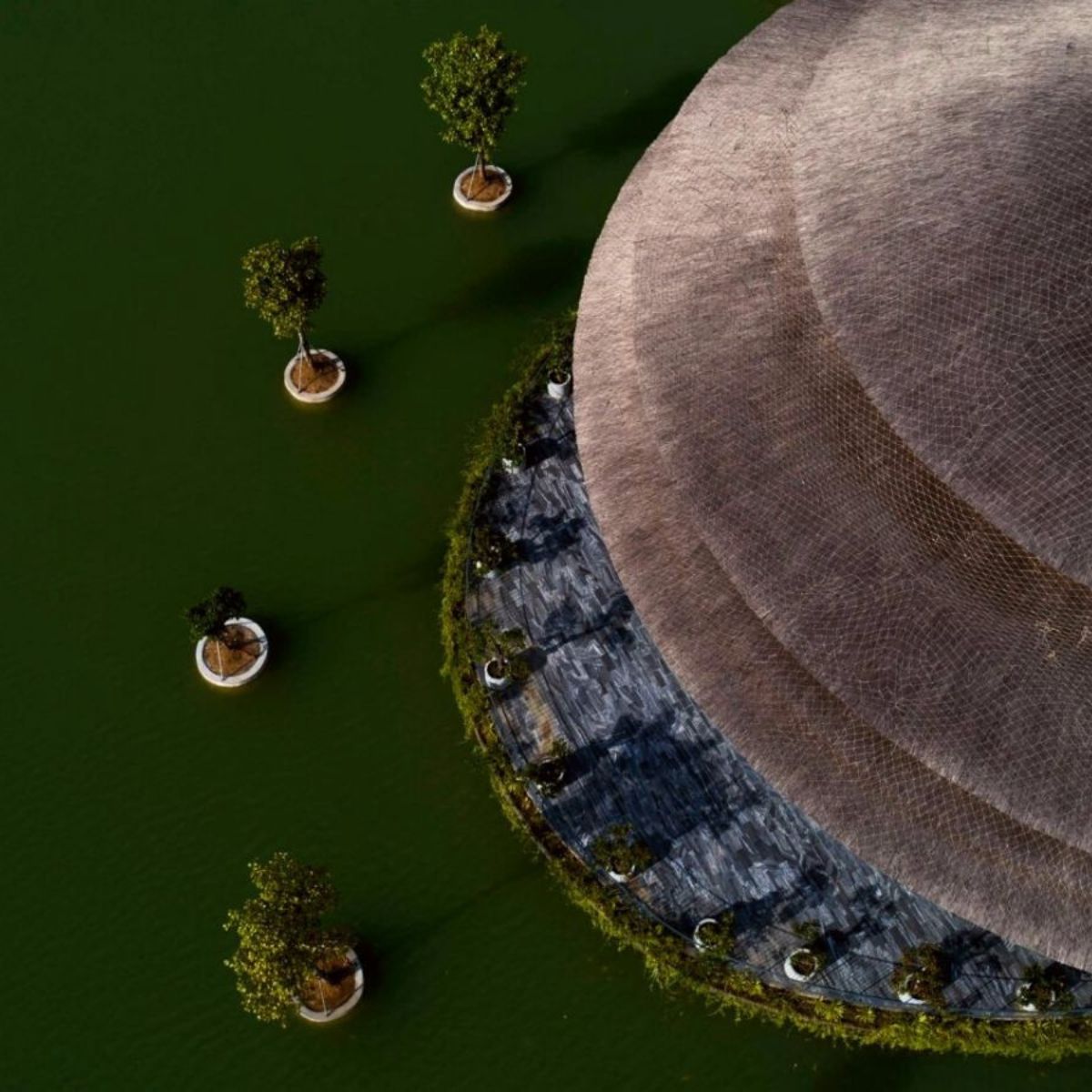 bamboo-dome-built-by-vo-trong-nghia-architects-has-turned-heads-over-a-lakeside-restaurant-featured