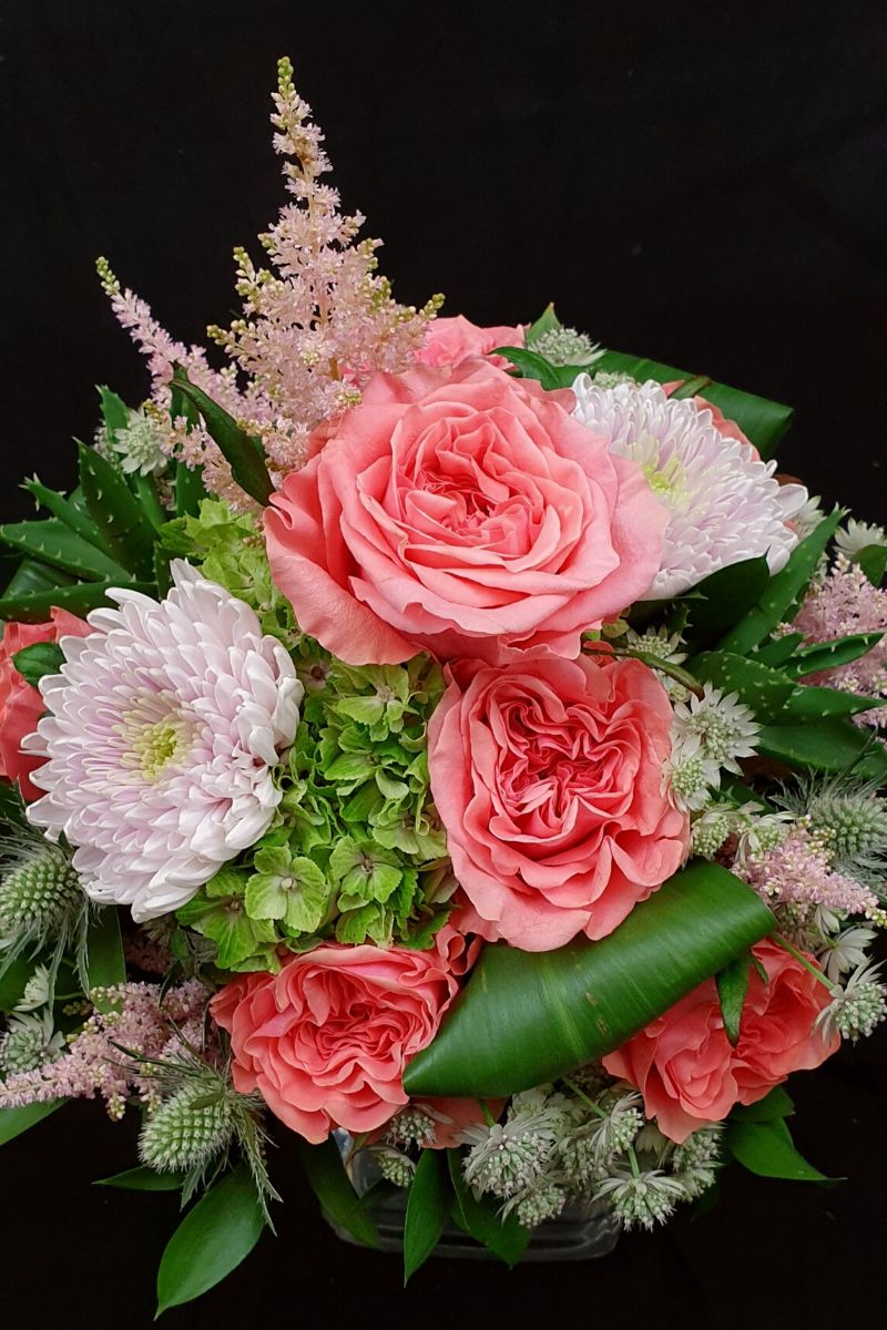 A colorful floral arrangement using Rose Blushing Reeva on Thursd