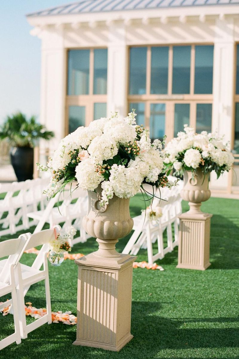 White wedding hydrangeas used to decorate wedding aisles on Thursd