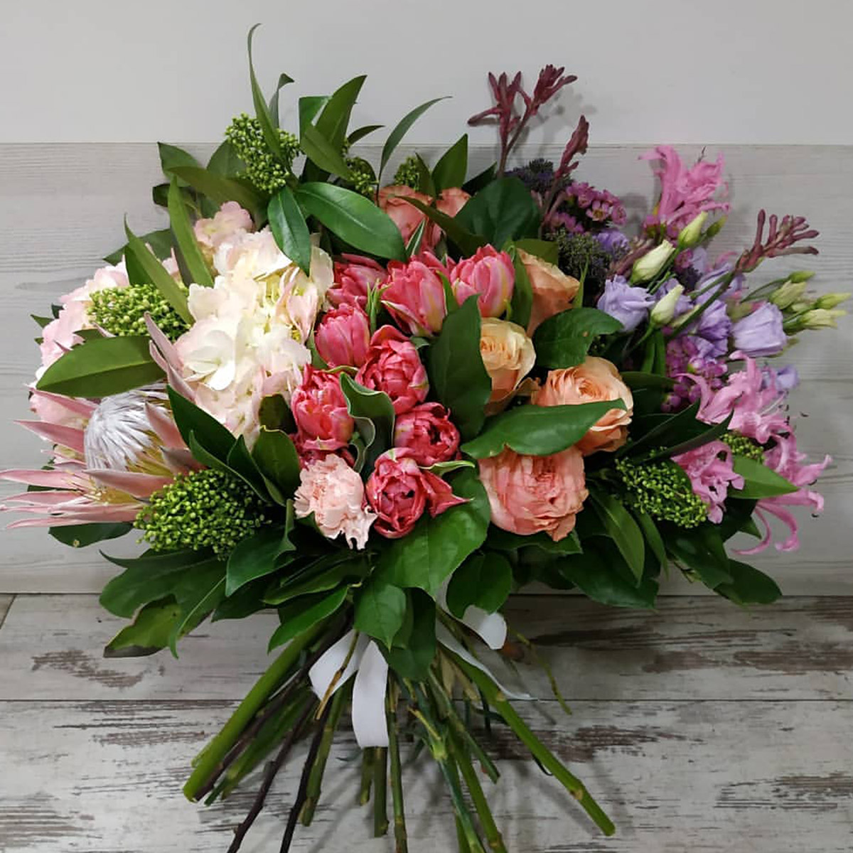 Protea Tulip and salal bouquet on Thursd