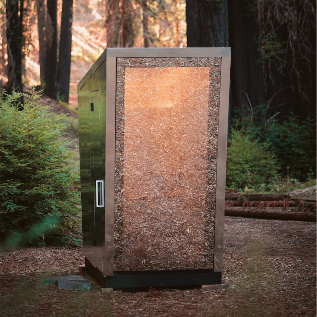 take-a-look-at-the-the-portal-toilet-by-jupe-that-camouflages-in-the-woods-like-a-sci-fi-doorway-featured