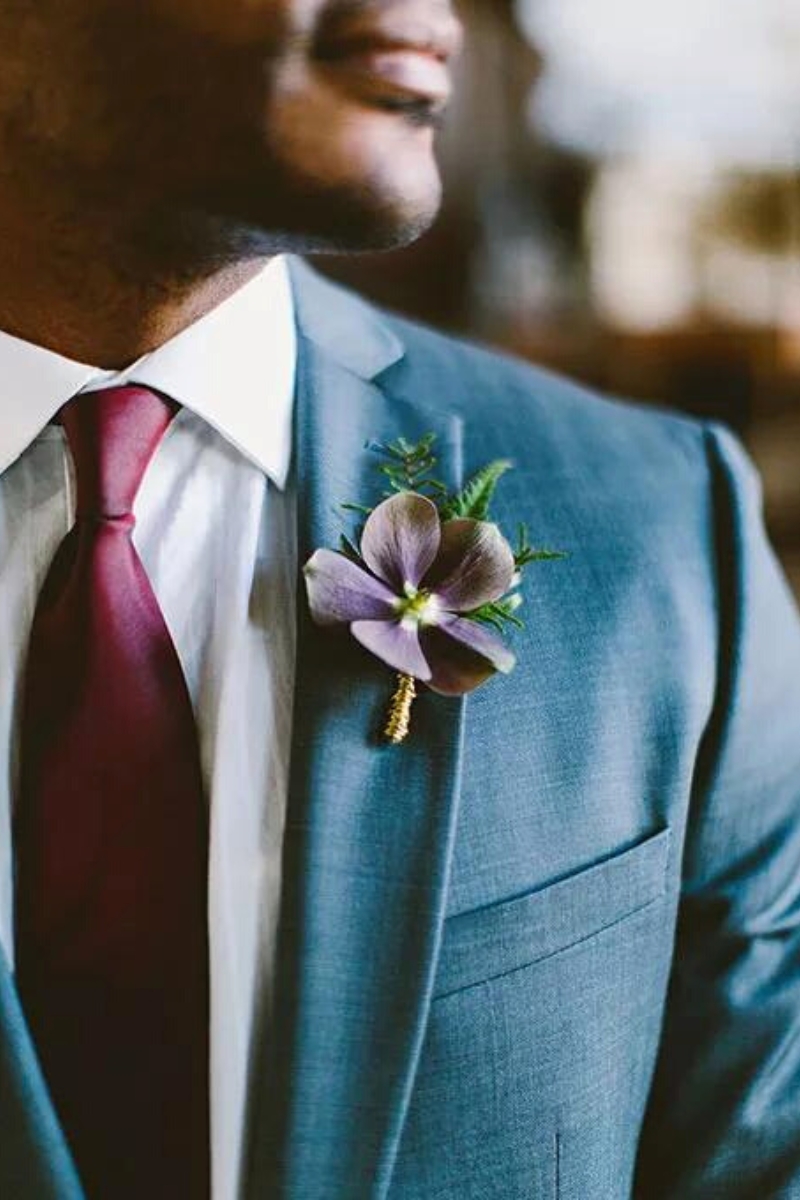 Wedding boutonniere using purple clematis on Thursd