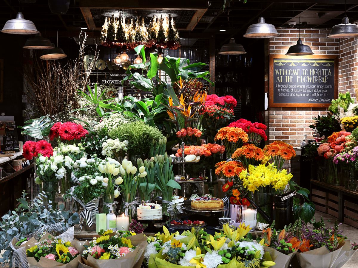 Fresh flowers in supermarket flower shop on Thursd