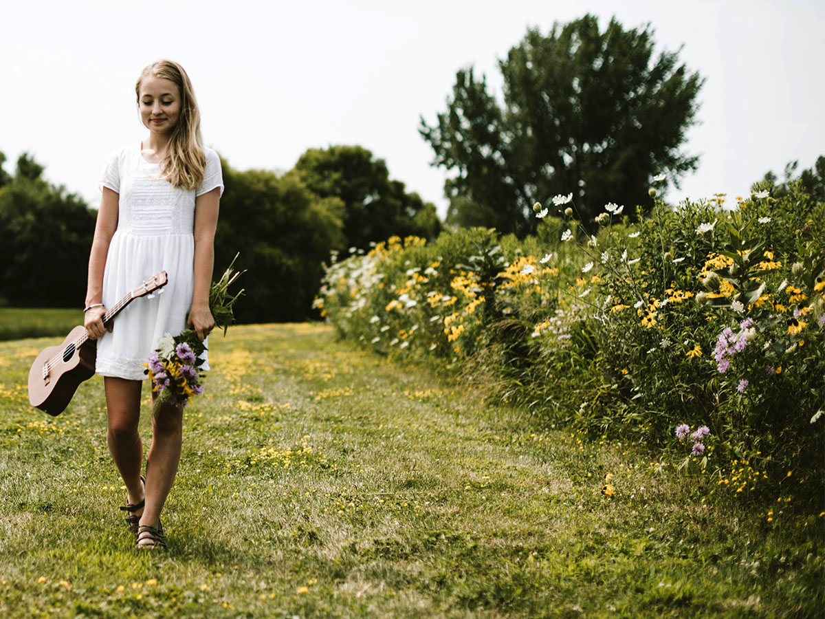 Woman with ukelele and flowers by Samantha Gades