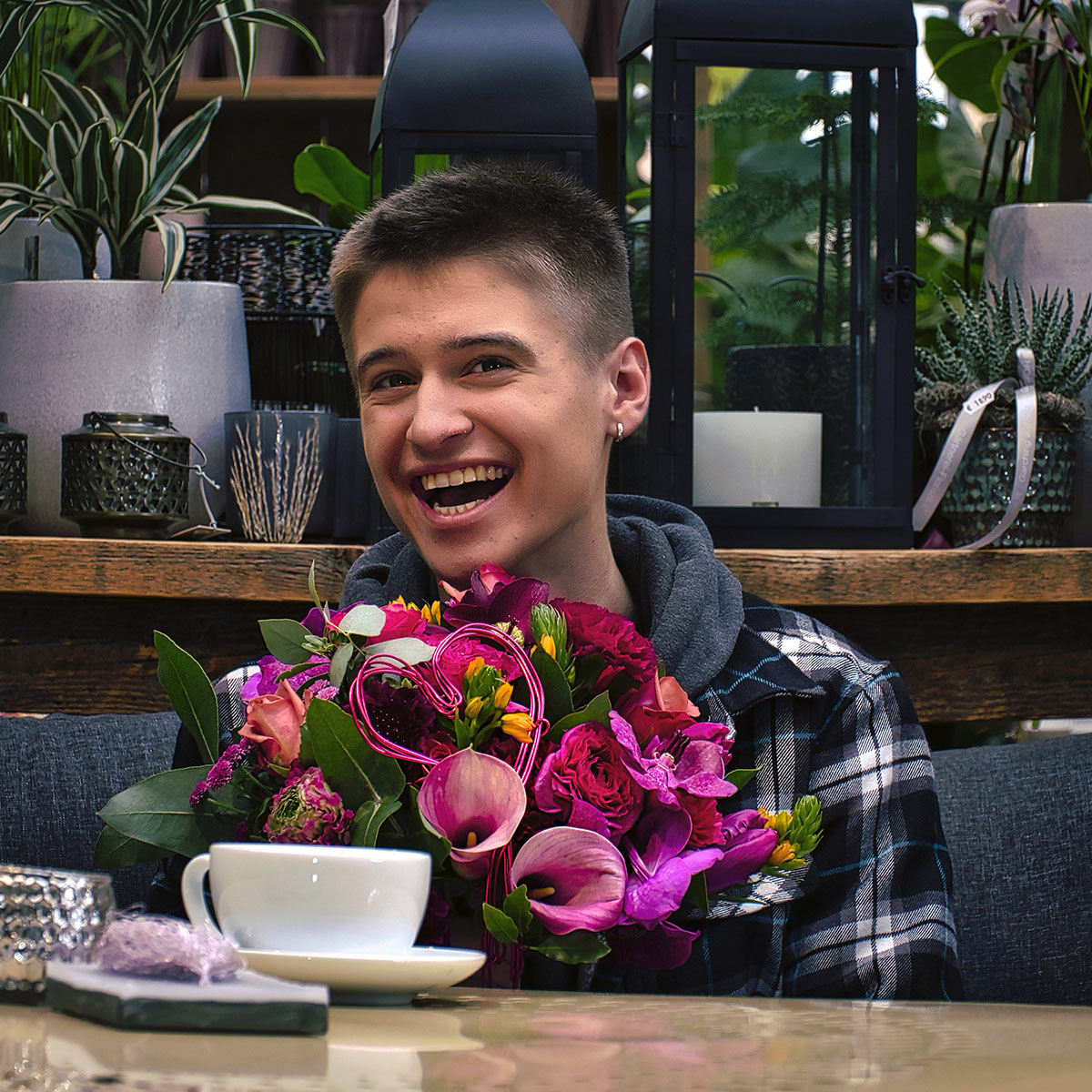 Boy with calla bouquet and coffee