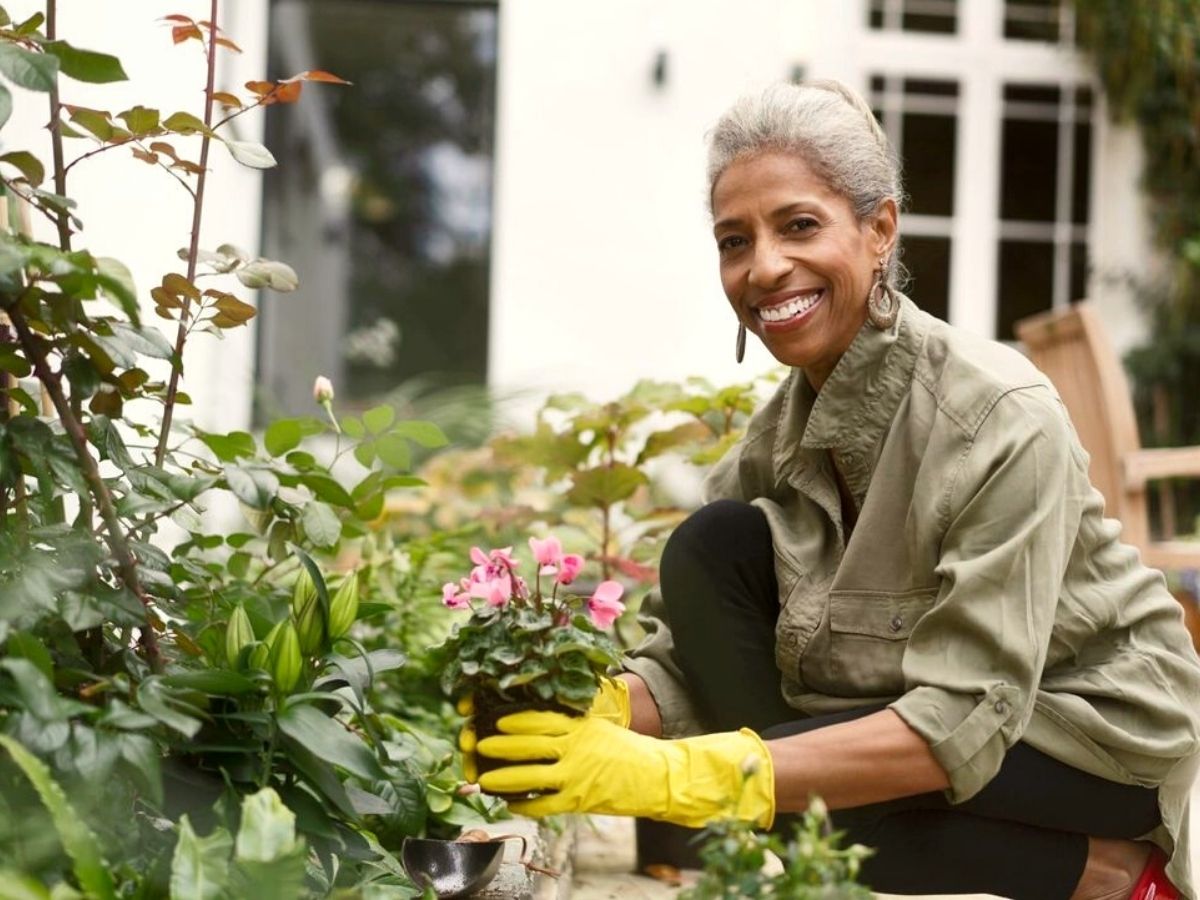 Happy woman on a full on gardening day