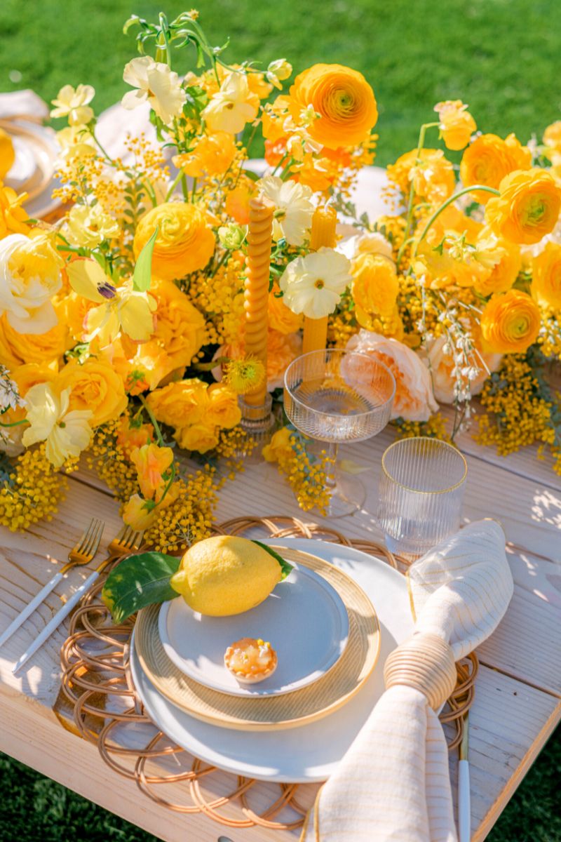 A gorgeous yellow table setting using yellow Rosaprima roses