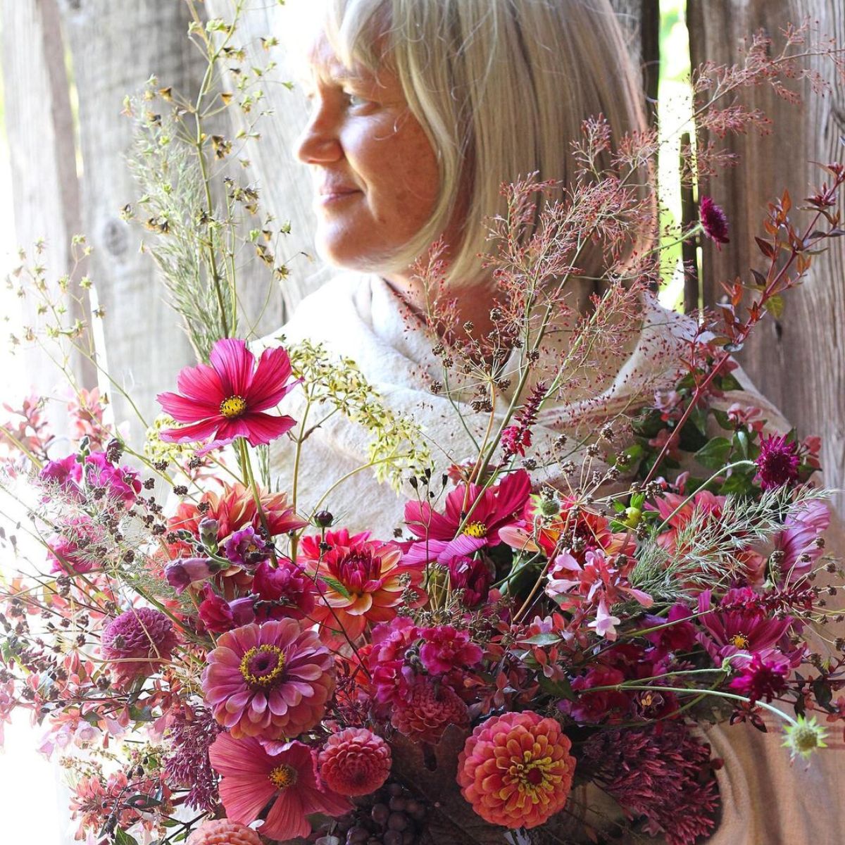 Becky Feasby with a floral arrangement designed by her