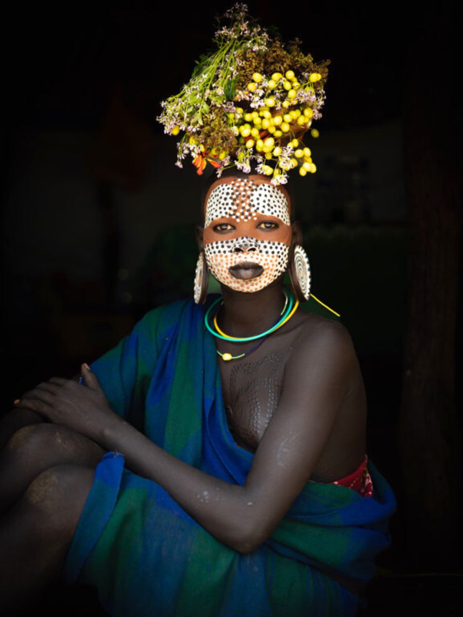 Mursi women love wearing flowers as tradition and reverence to nature