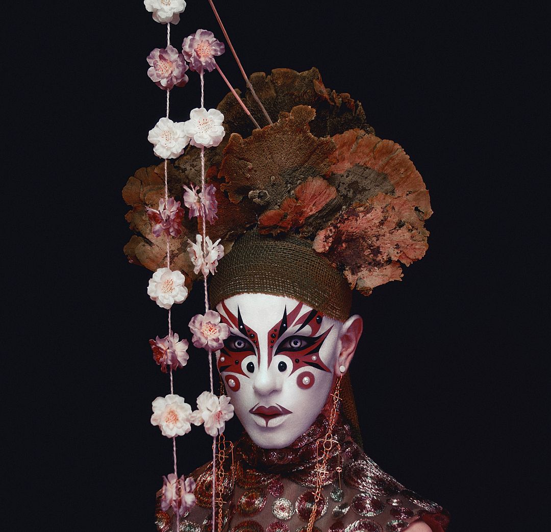 Ryan Burke Model With Mushrooms Headpiece and Brown and White Floral Make-Up on Thursd