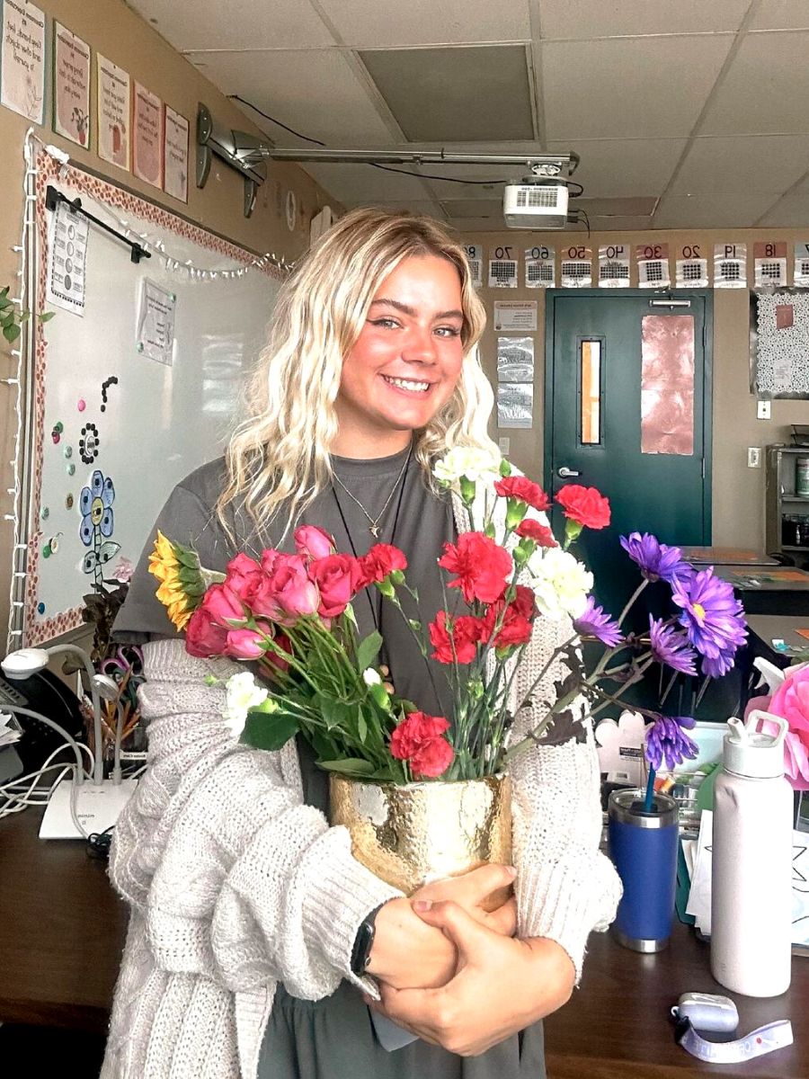 Teacher celebrating with flowers