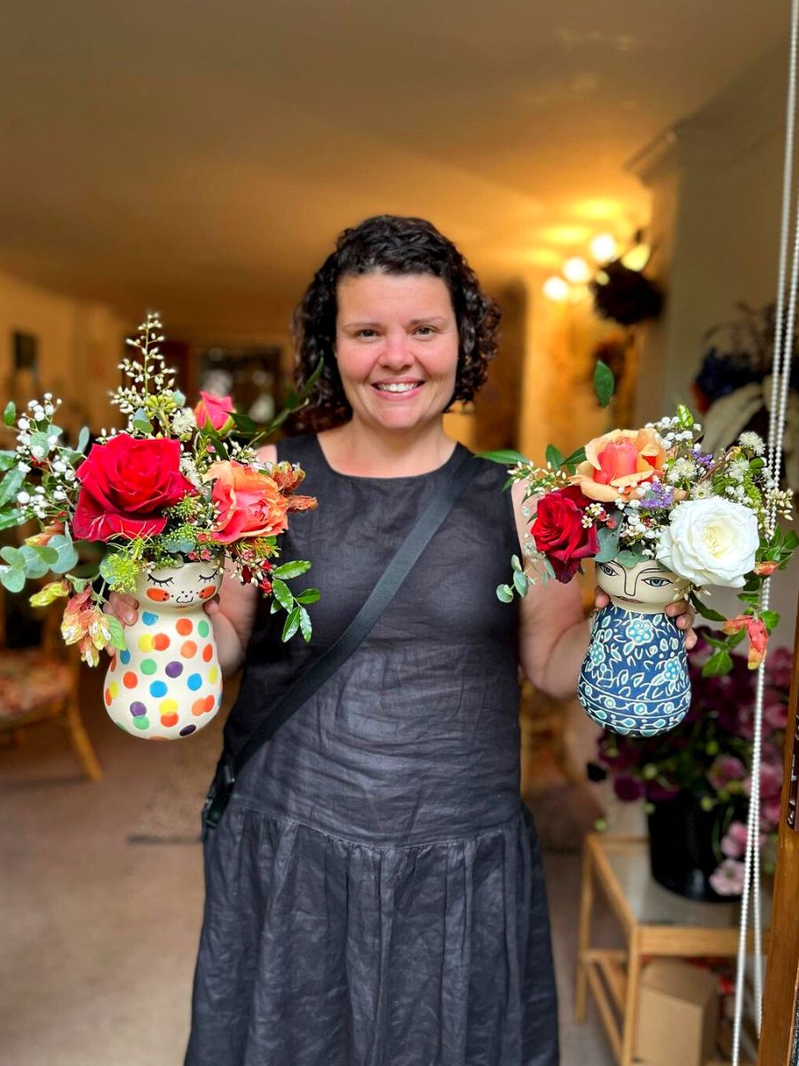 Happy teacher with flowers