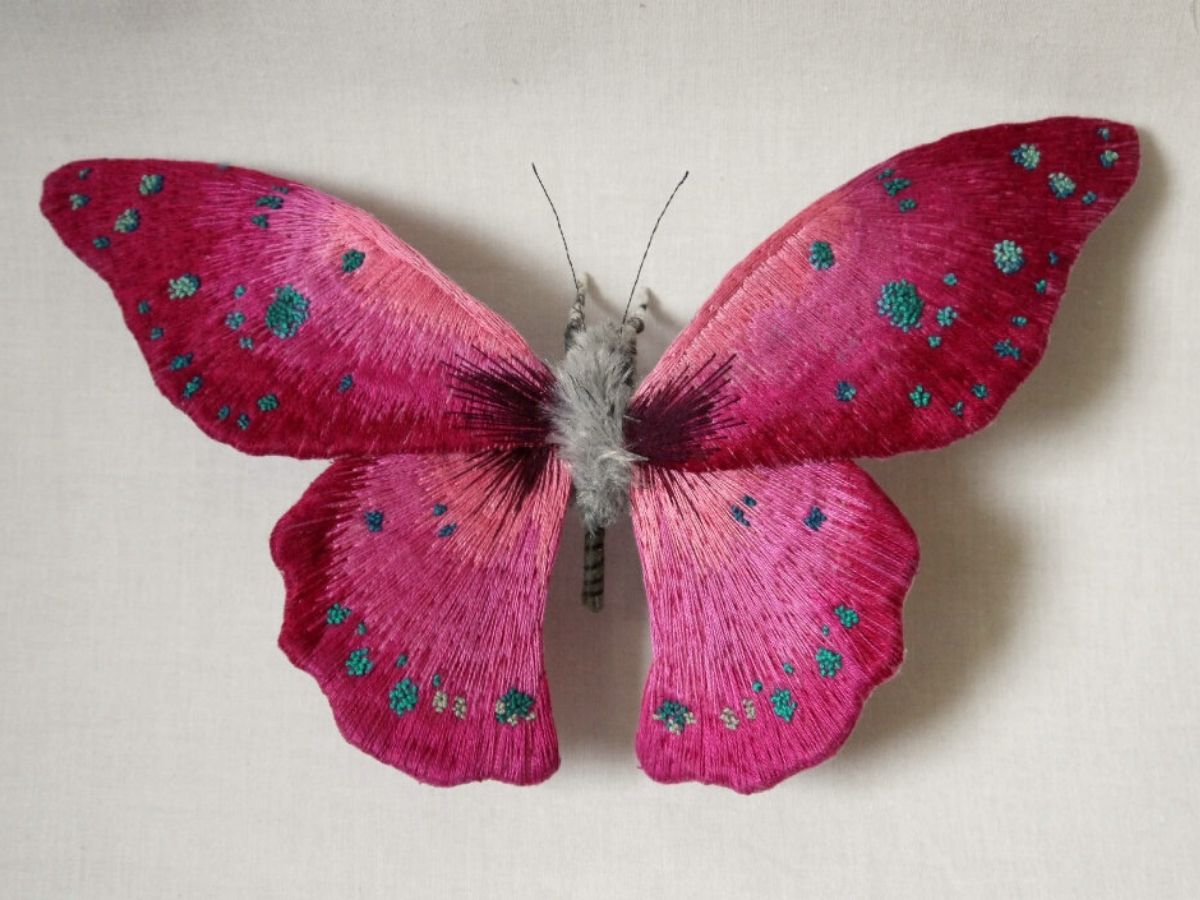 Pink embroidered butterfly art