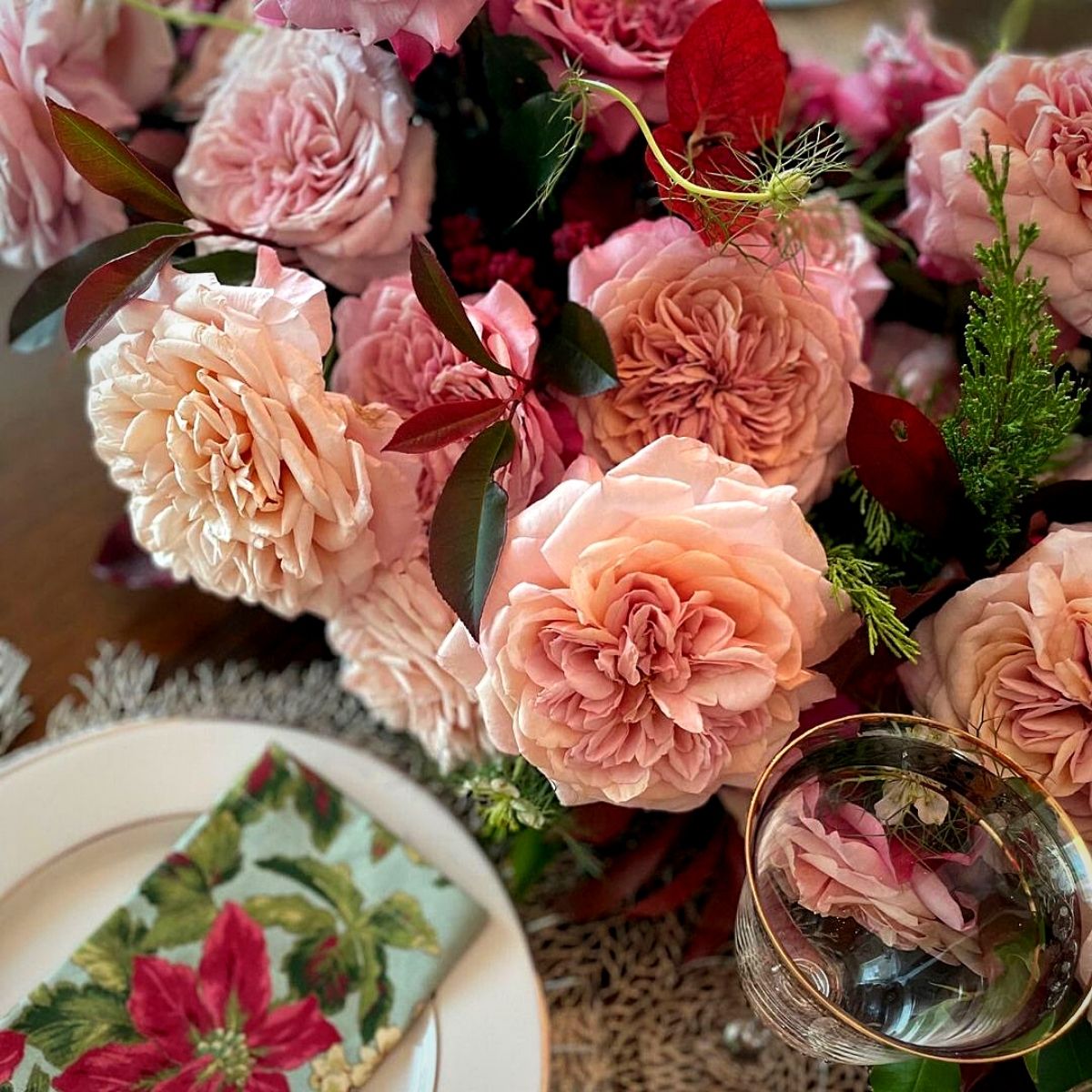 floral arrangement with pastel colored roses