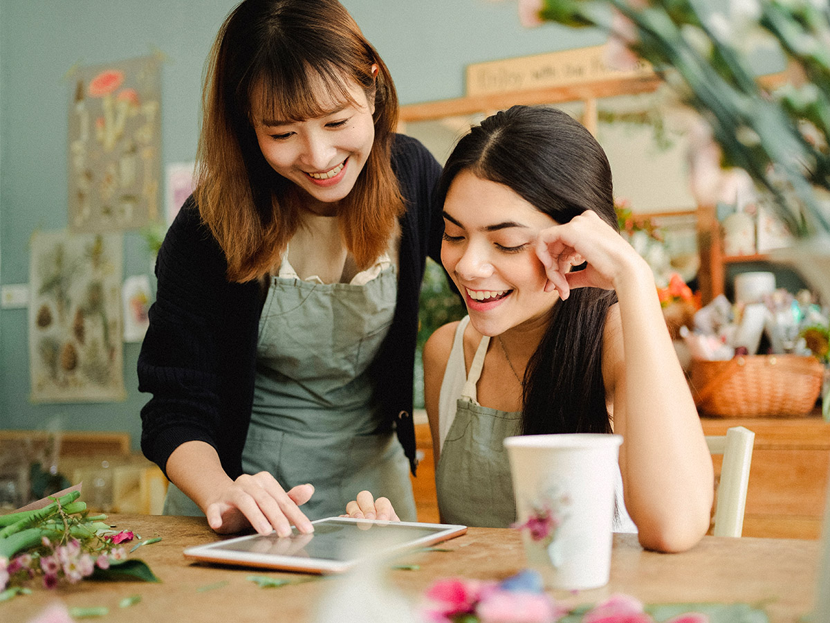 Two florists on an iPad company culture