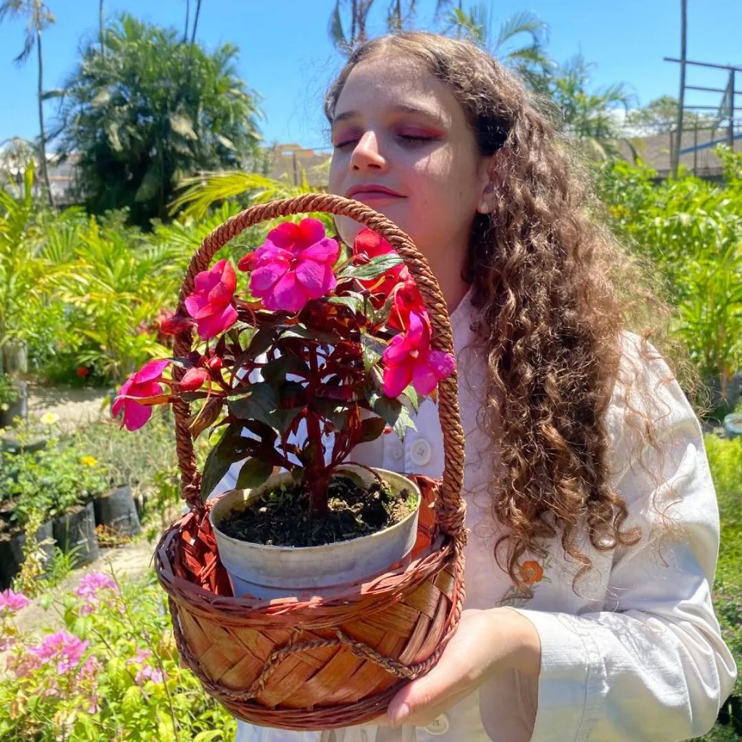 Girl holding Impatiens