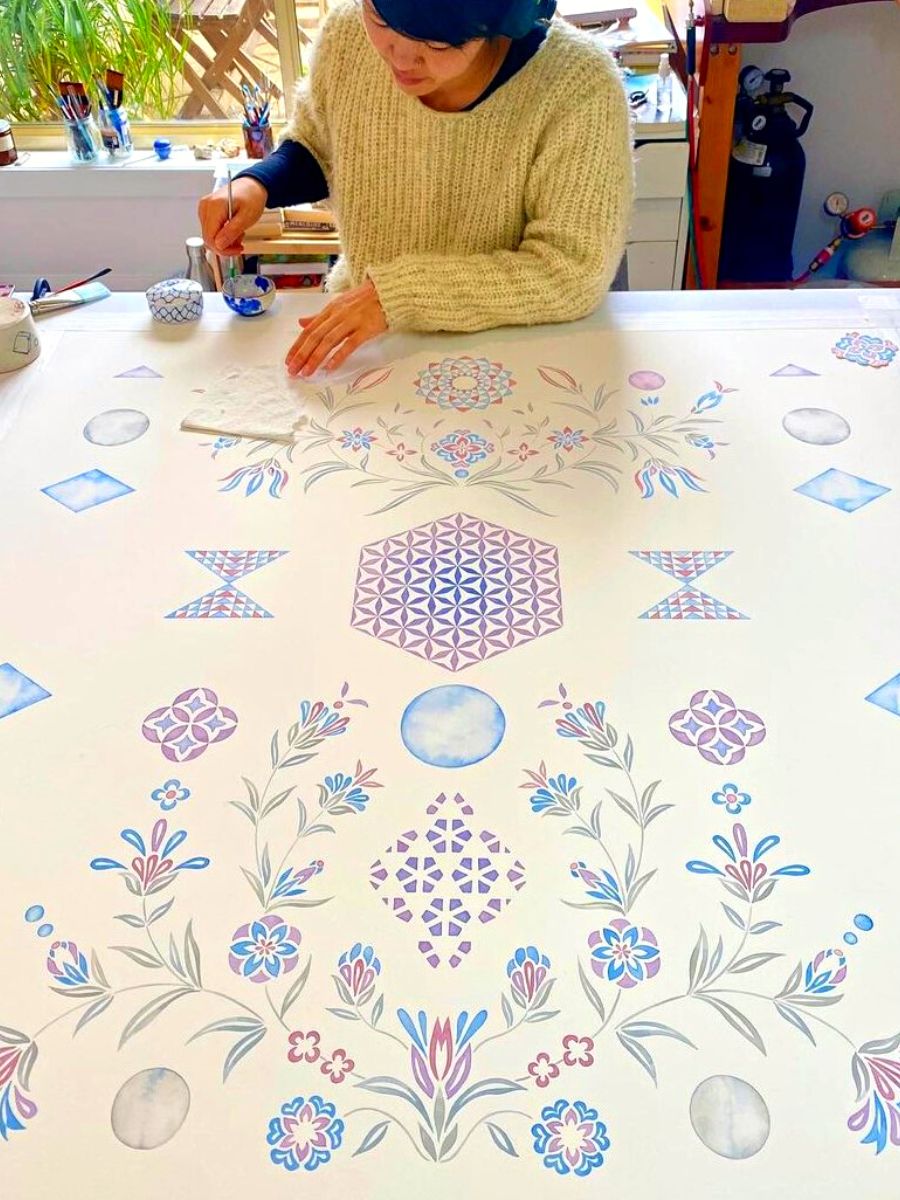 Yuria Okamura working in her painted plant art