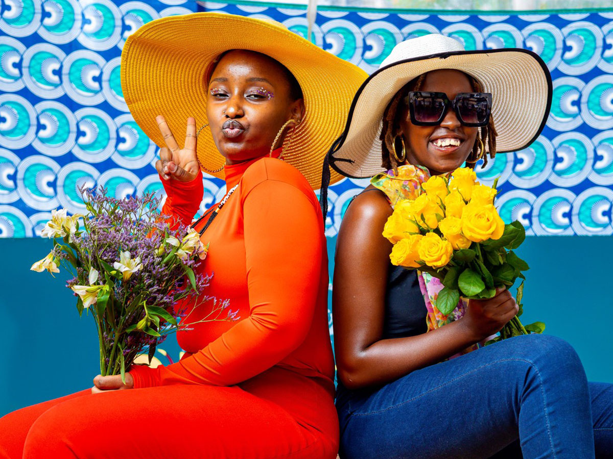Two kenyan models with flowers