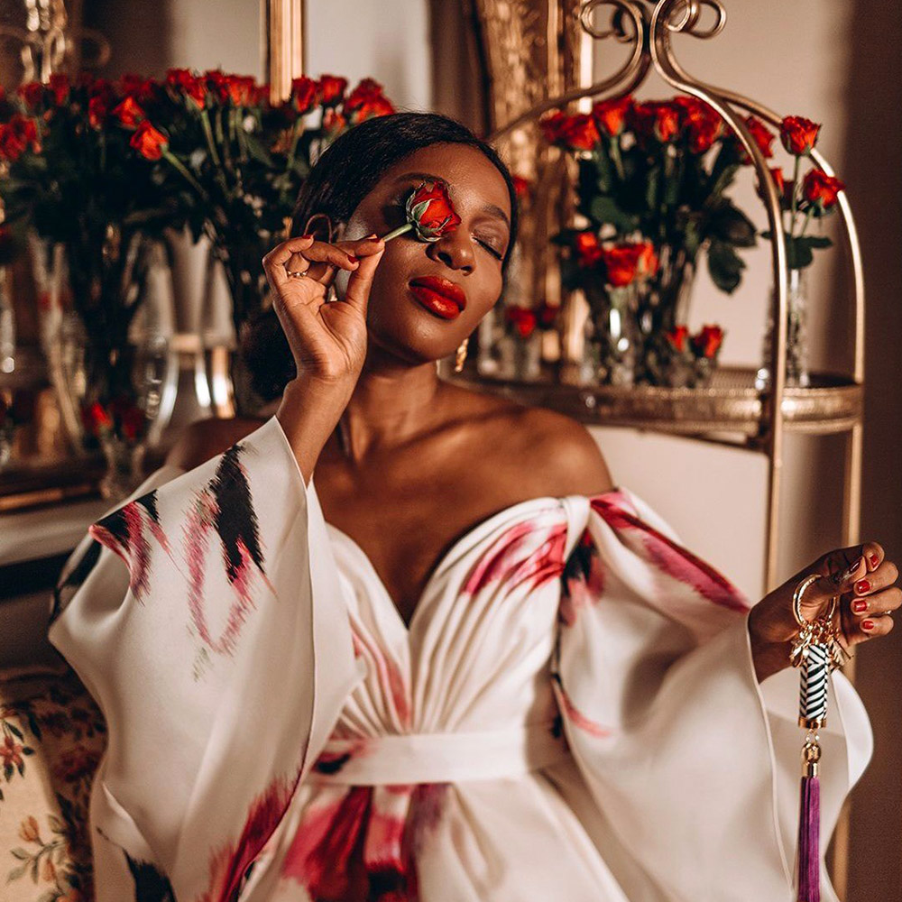 Kenyan woman stylish with red rose 