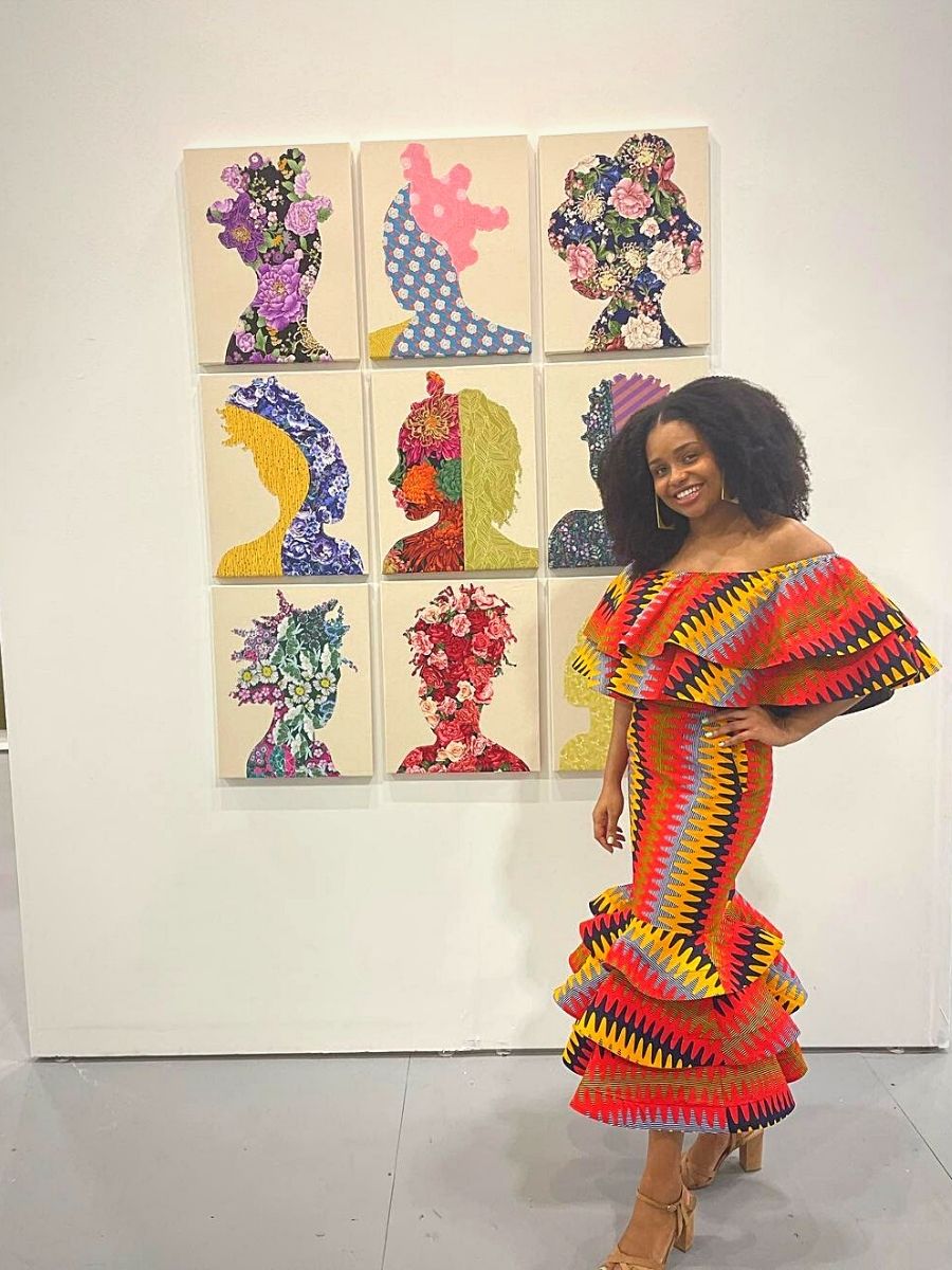 Gio Swaby poses beside a collage of her artistic works