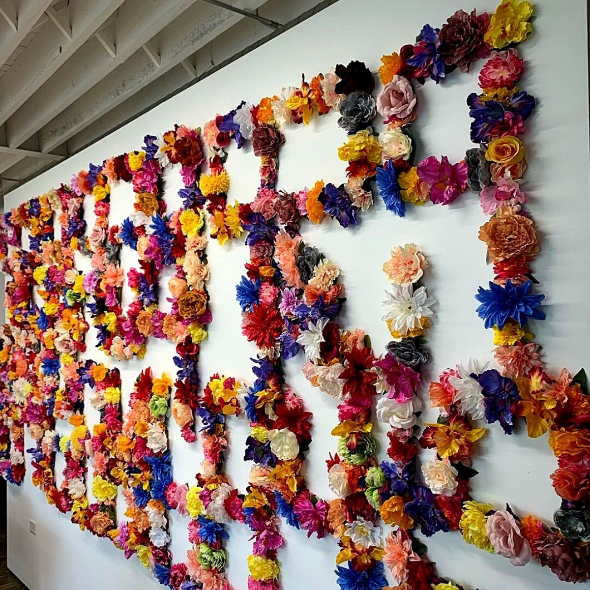Floral arrangement by Nick Cave on a wall at Facility Chicago