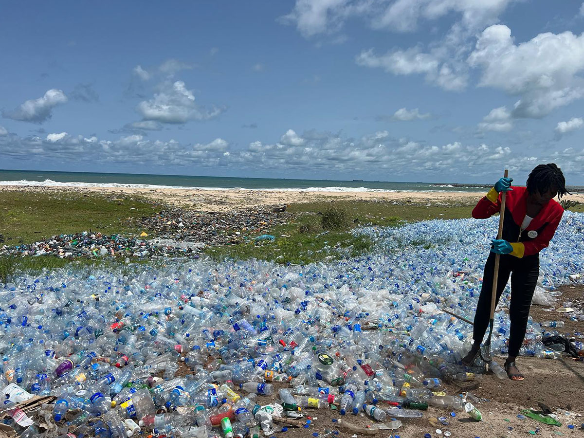 Cleaning plastic from a beach in Nigeria