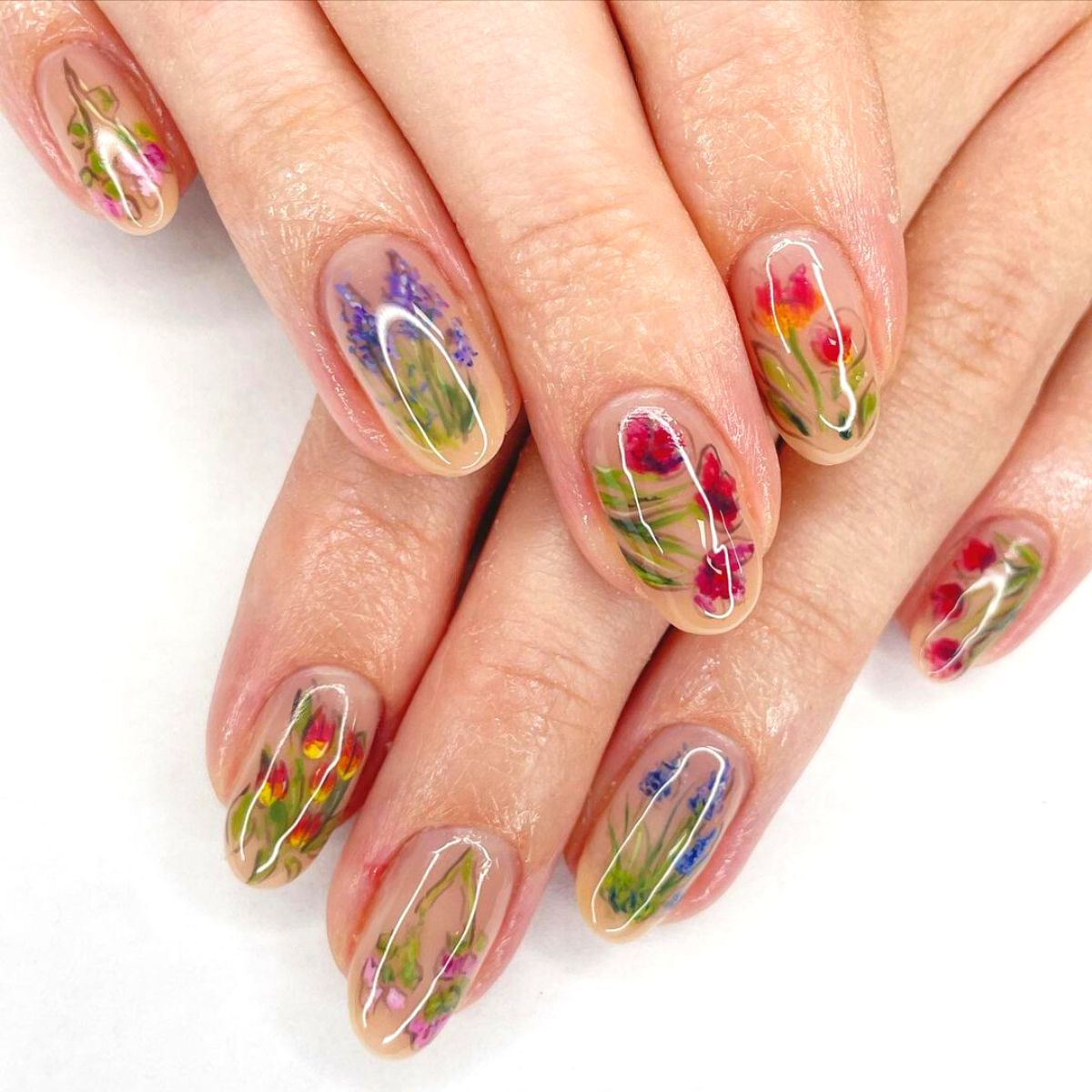 Glossy floral design on nails