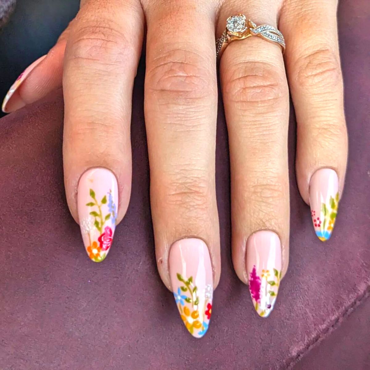 Pastel and bold colored manicure with flowers