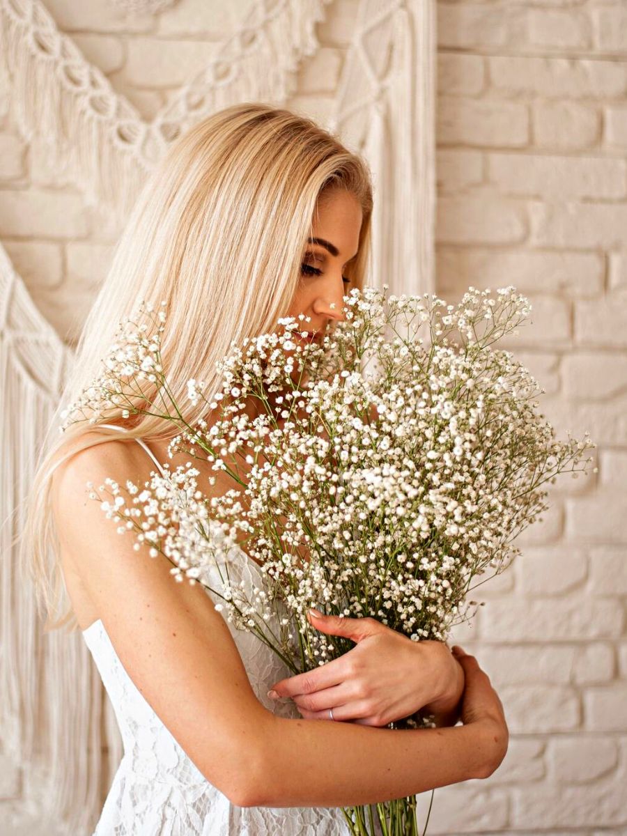 Woman hugging the beauty of babys breath