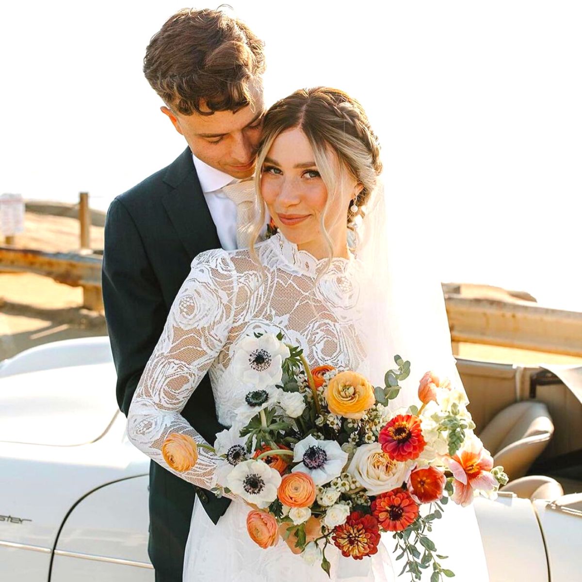 Happy couple with flowers by Native Poppy