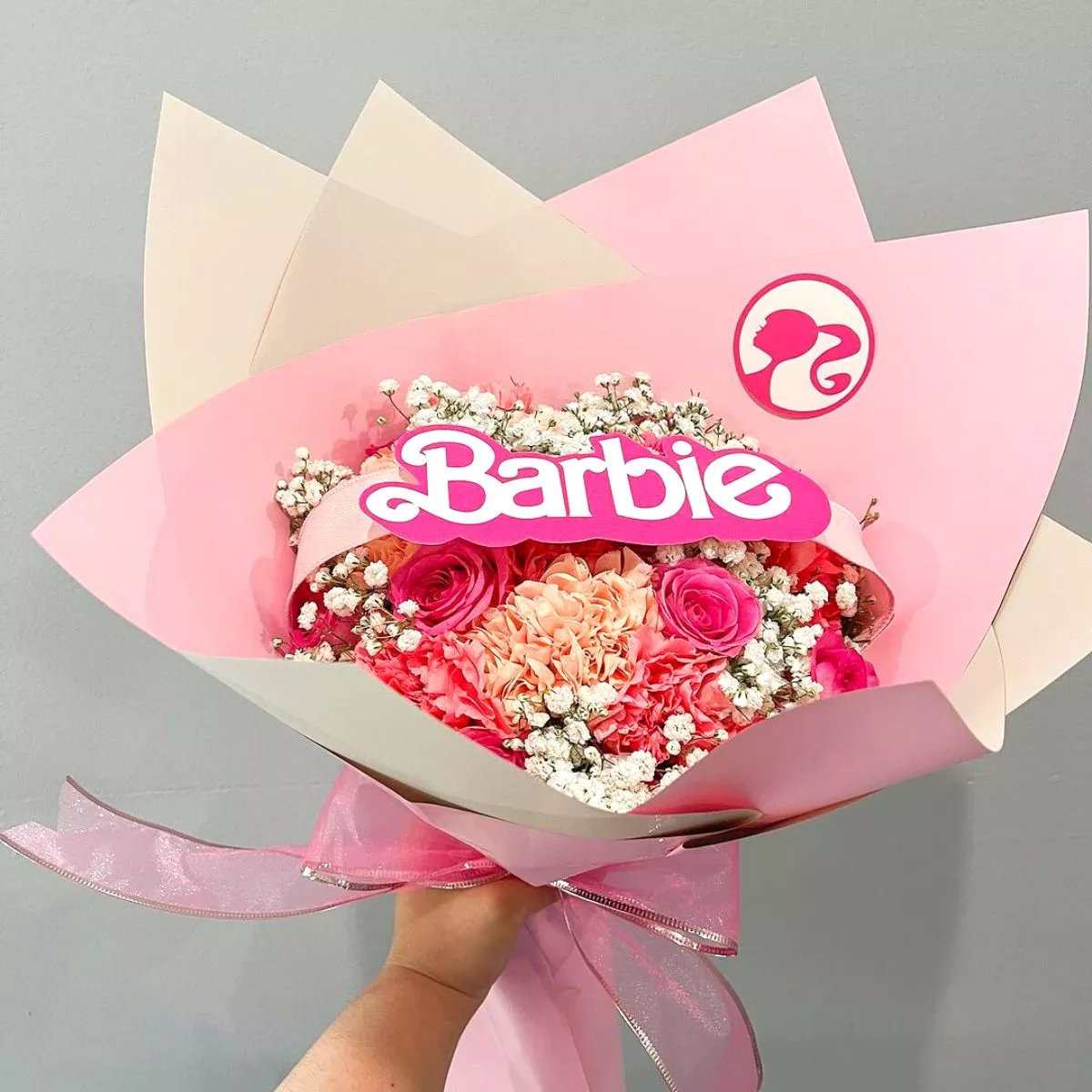 Barbie themed arrangement with roses