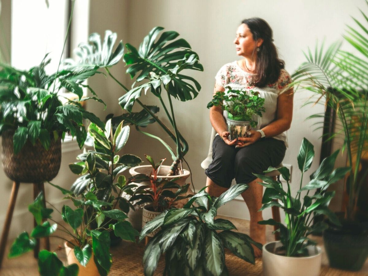 Lucy Ketchum in a background of plants