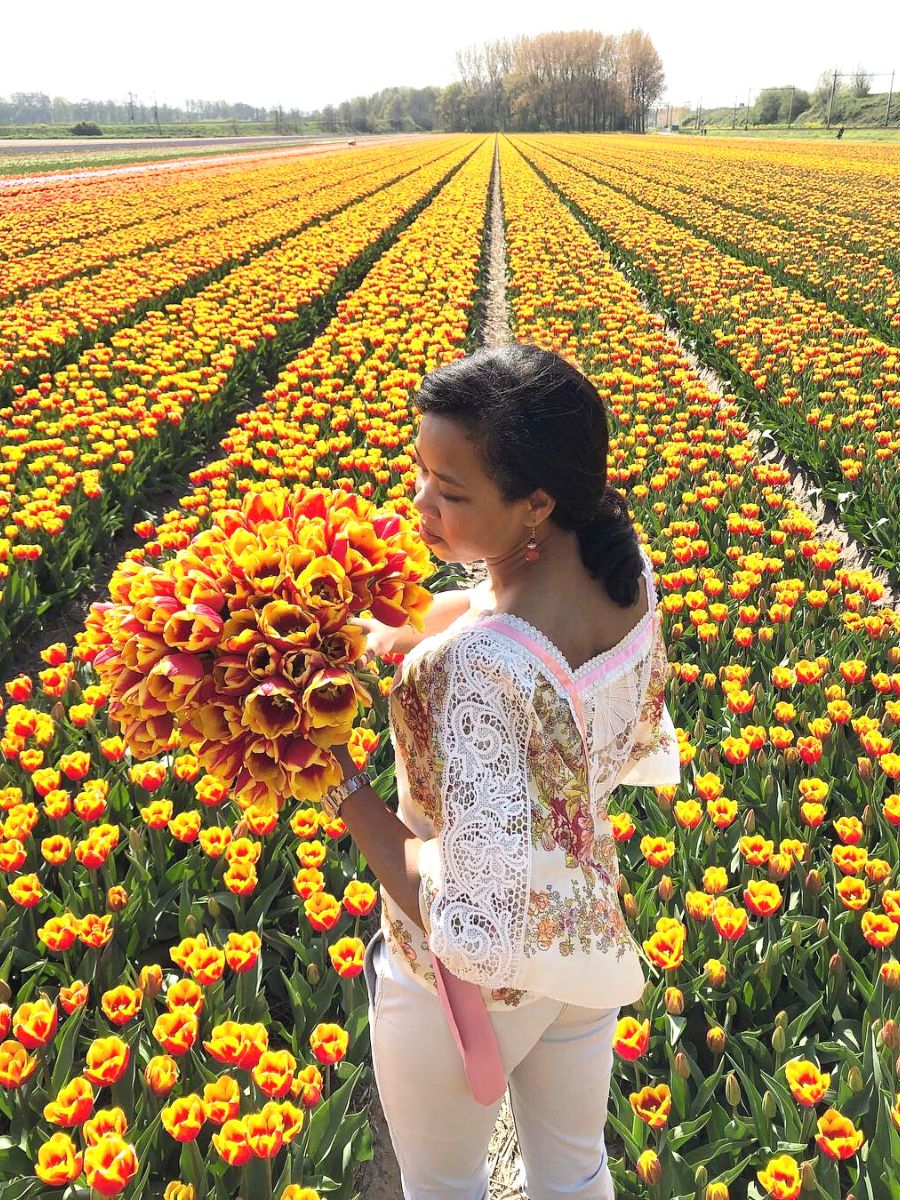 Natasja Sadi in a tulip field in Amsterdam