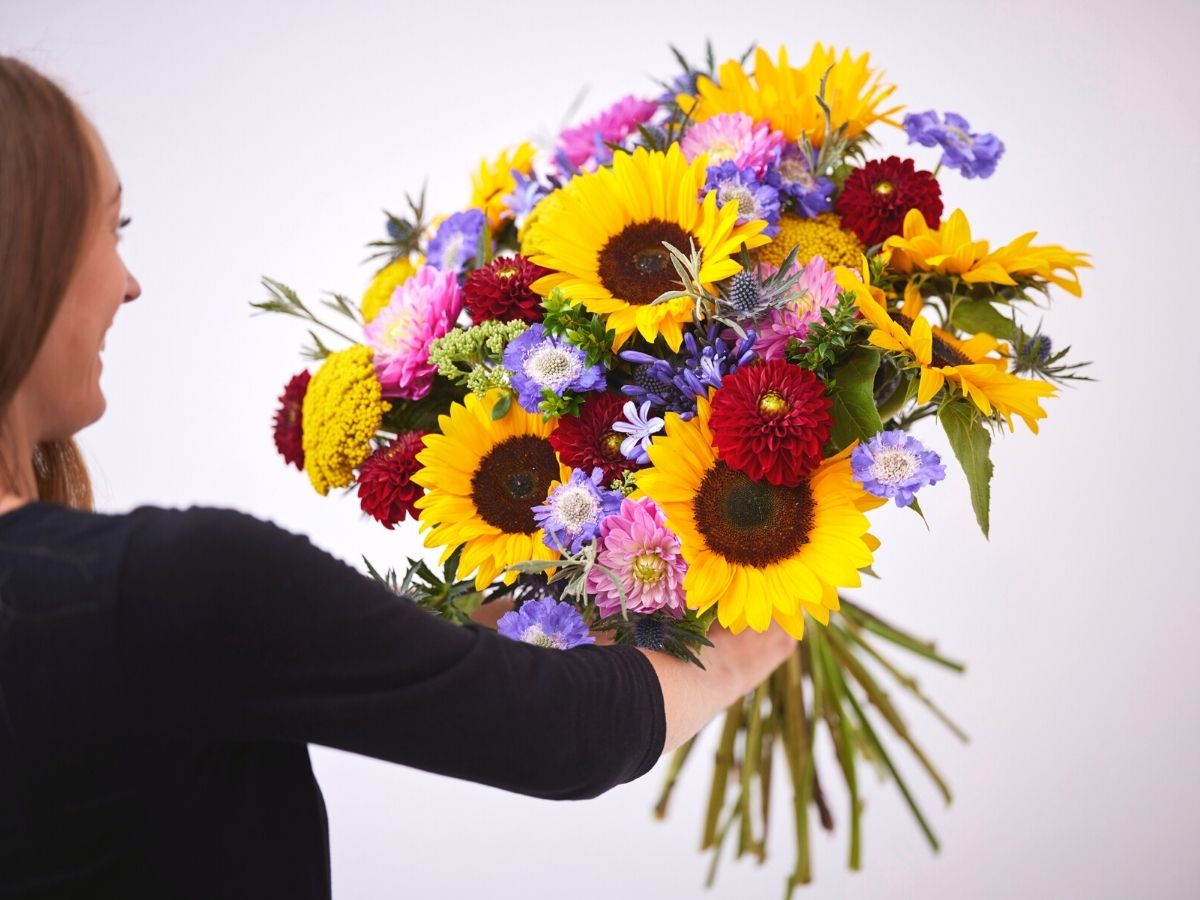 Side view of the colorful bouquet by Interflora to help bees