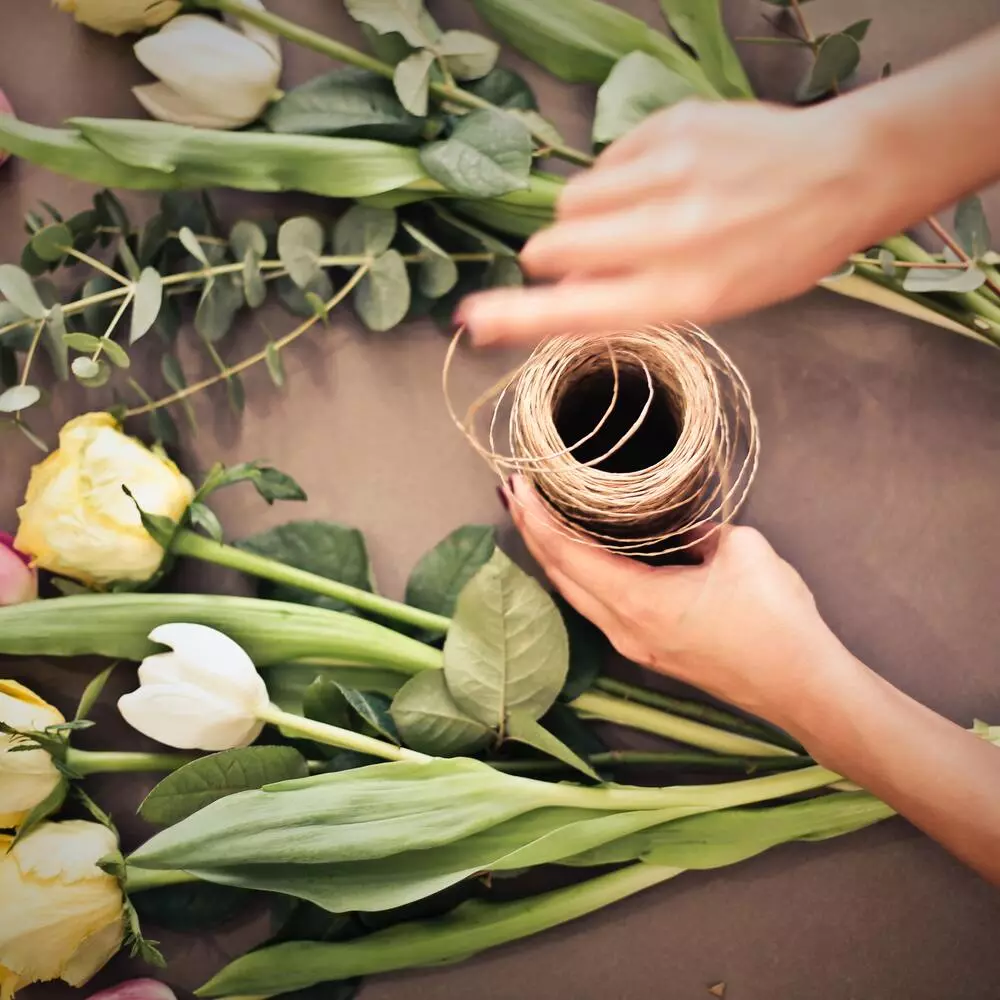 arranging flowers by Florist 