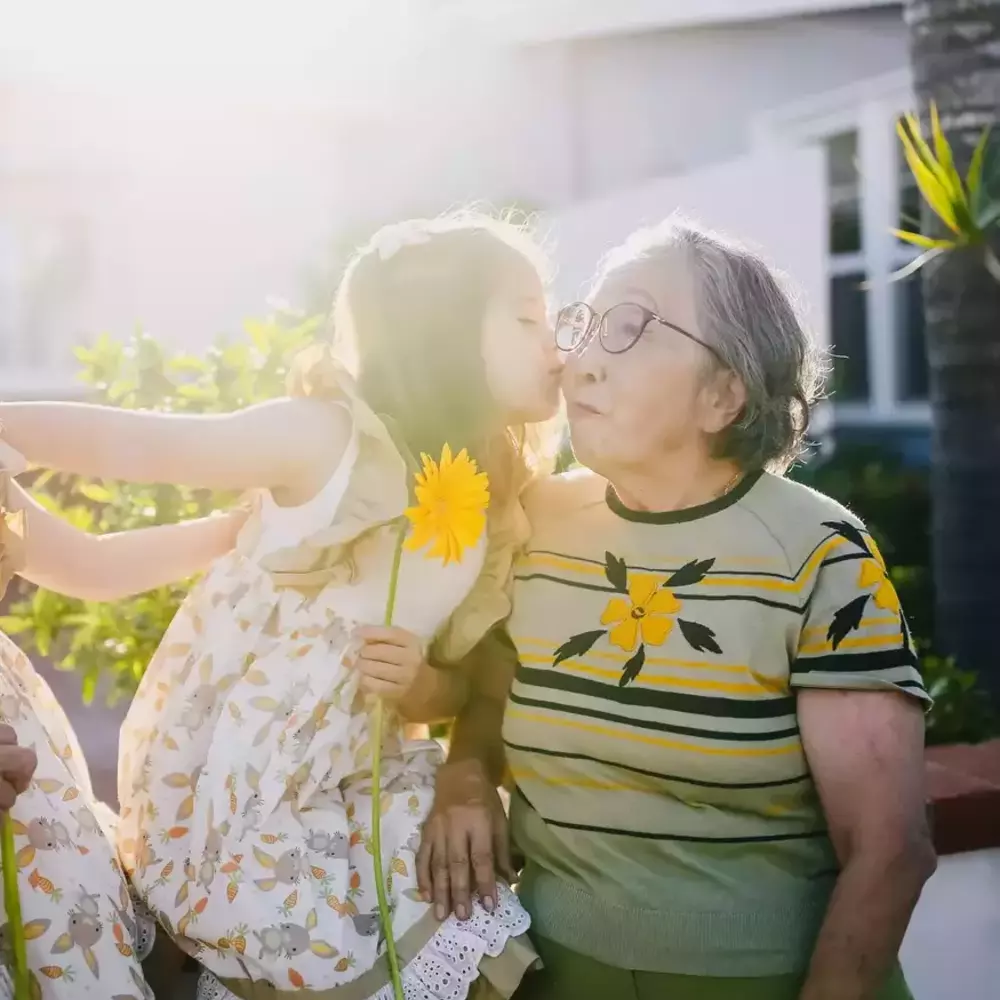 Littile child kiss to the grandmother