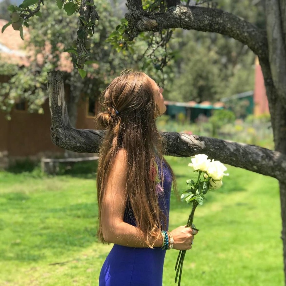 A Girl with Flower in garden area