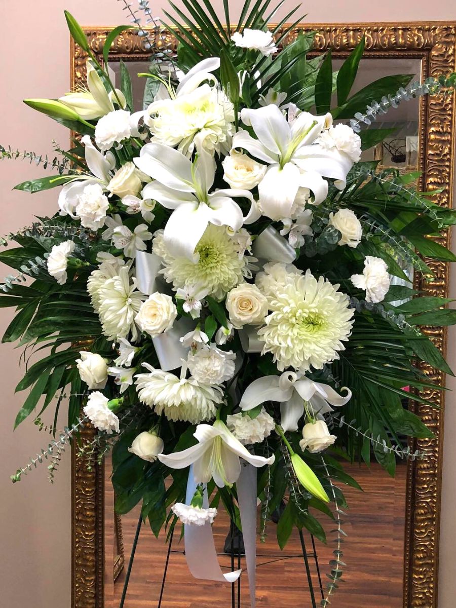 Arrangement using white mums as sympathy flowers