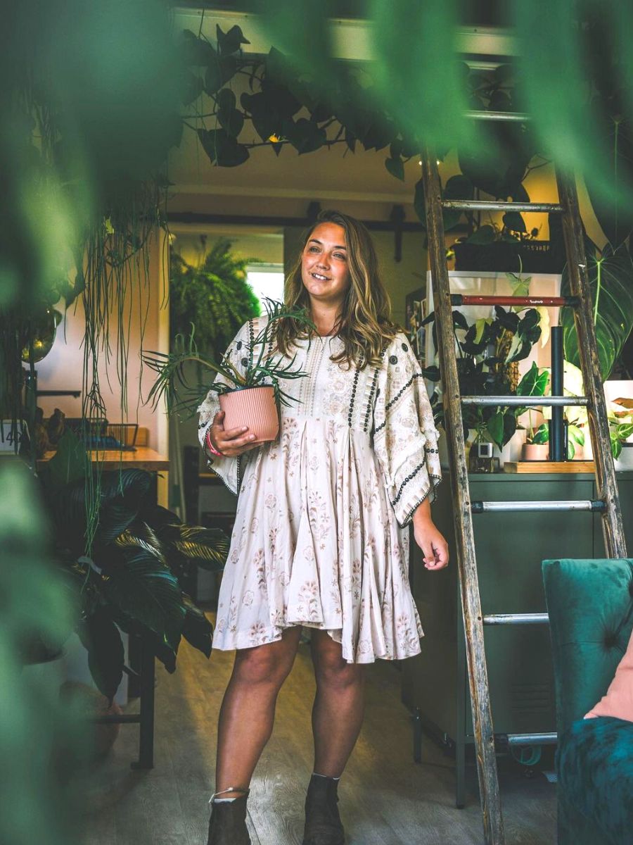 Woman with her indoor plant collection