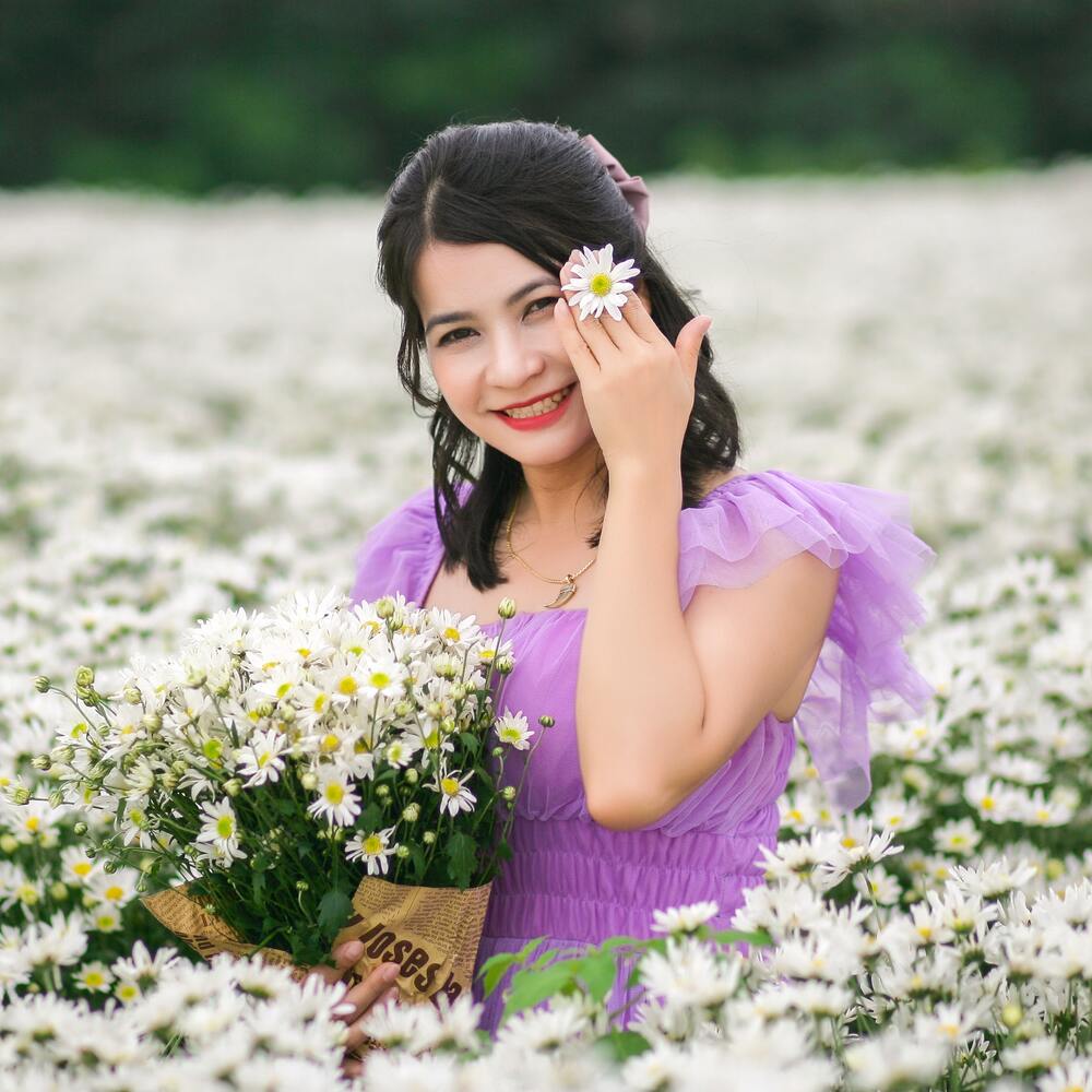 lady with white flower garden