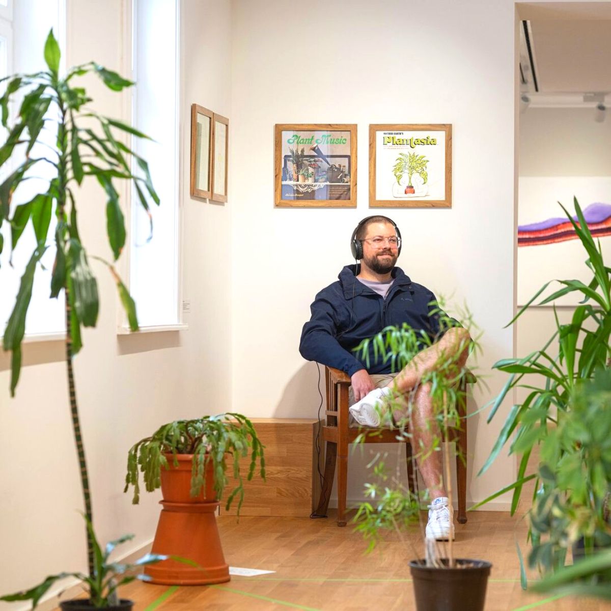 Person listening to plant music