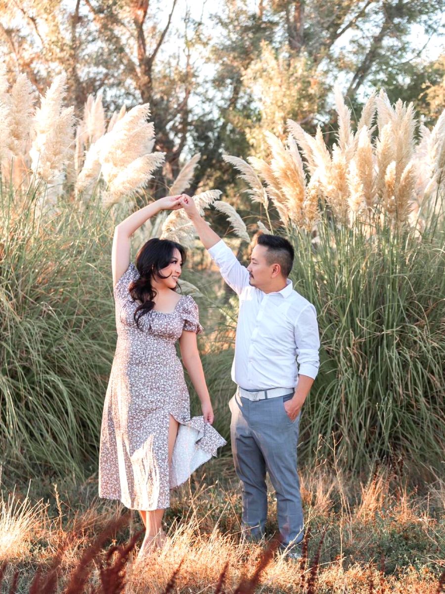 Couple around space with pampas grass