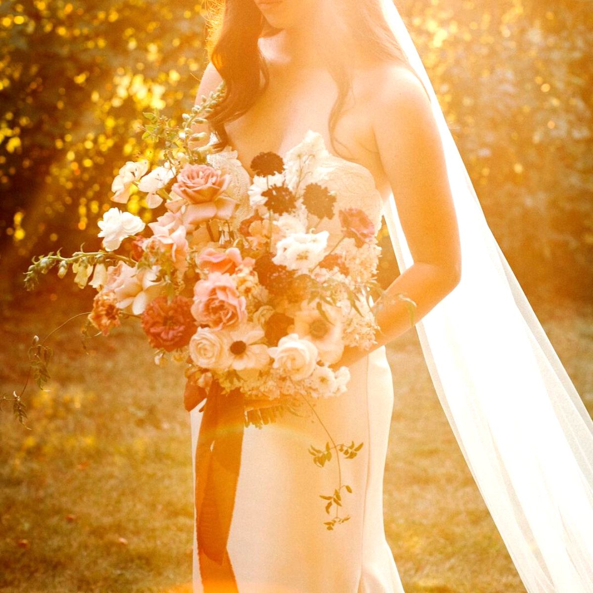 Rays of sun illuminating wedding bouquet