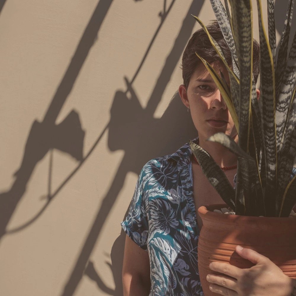 Man holding snake plant