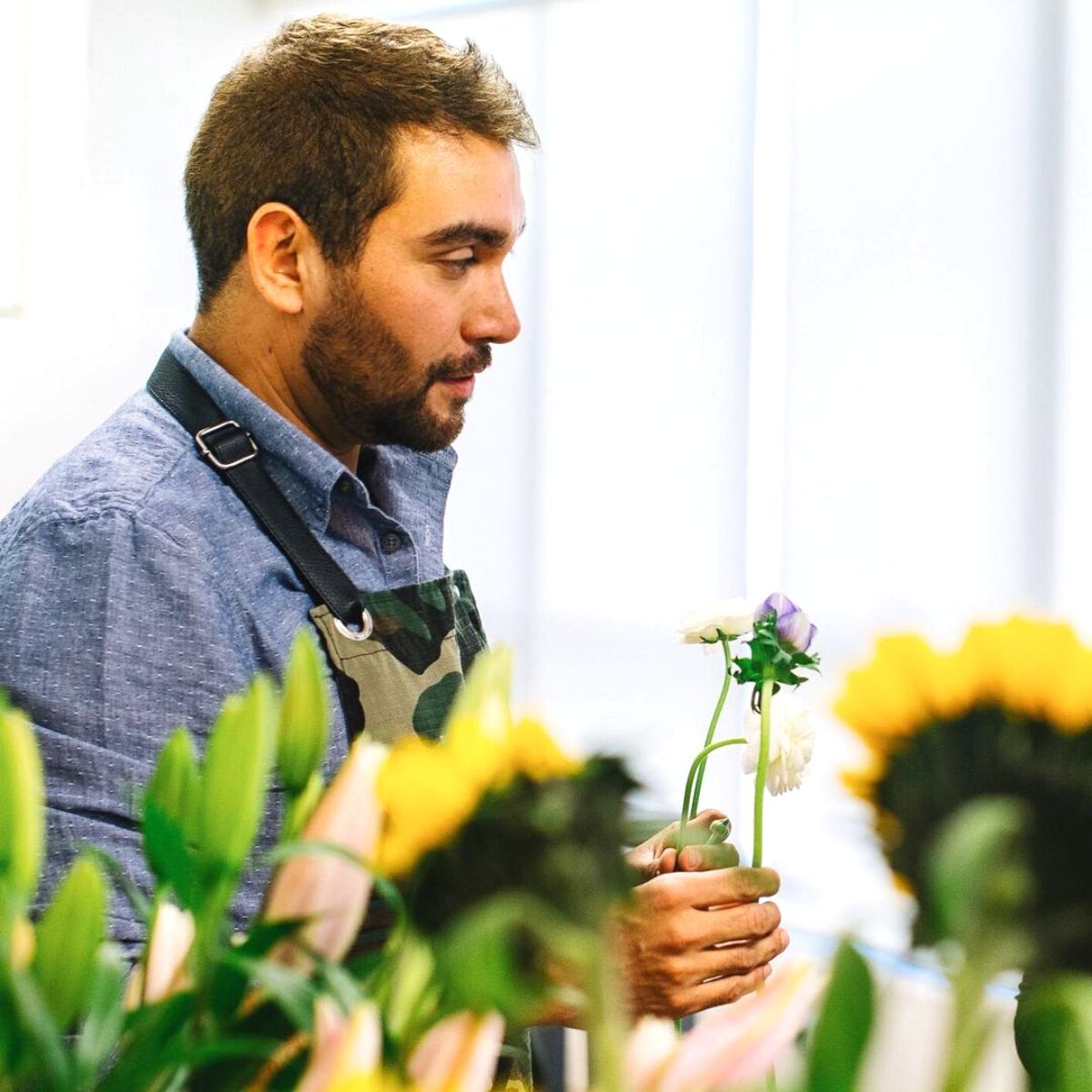 Victor Flores arranging flowers