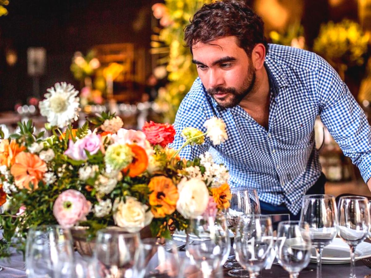 Victor Flores creating a table center with flowers