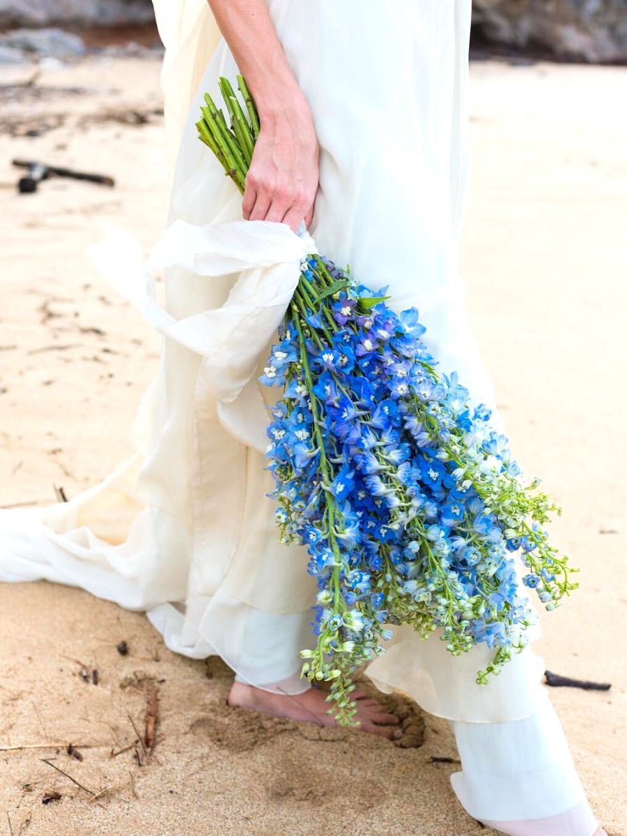 Wedding bouquet using blue delphiniums