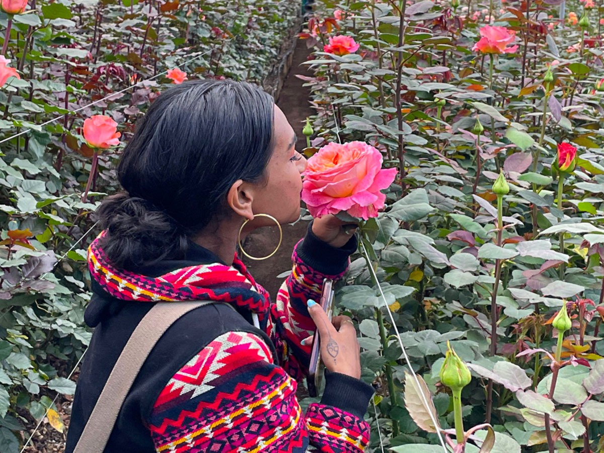 Fresh-o-Fair Ecuador Trip florist smelling rose